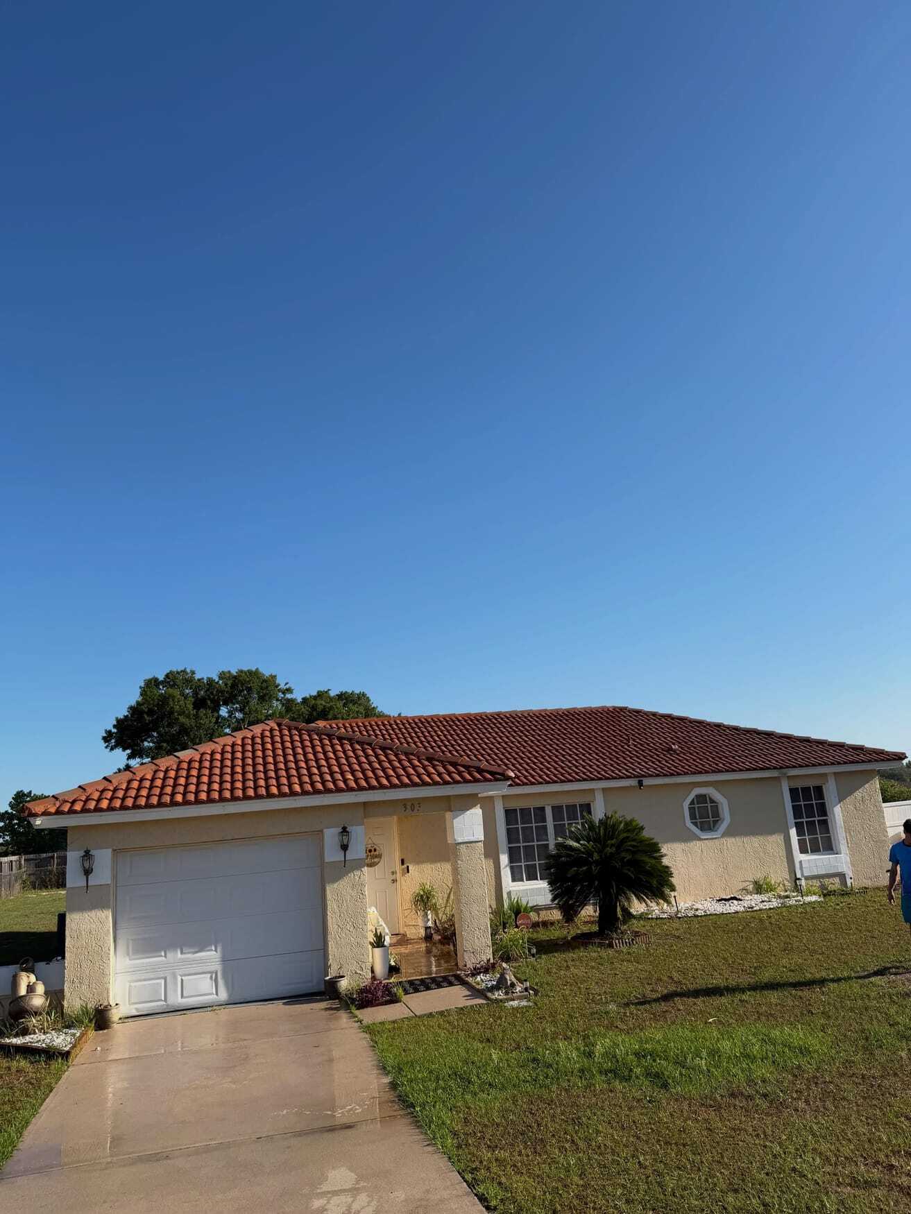The same tile roof cleaned back to red tile
