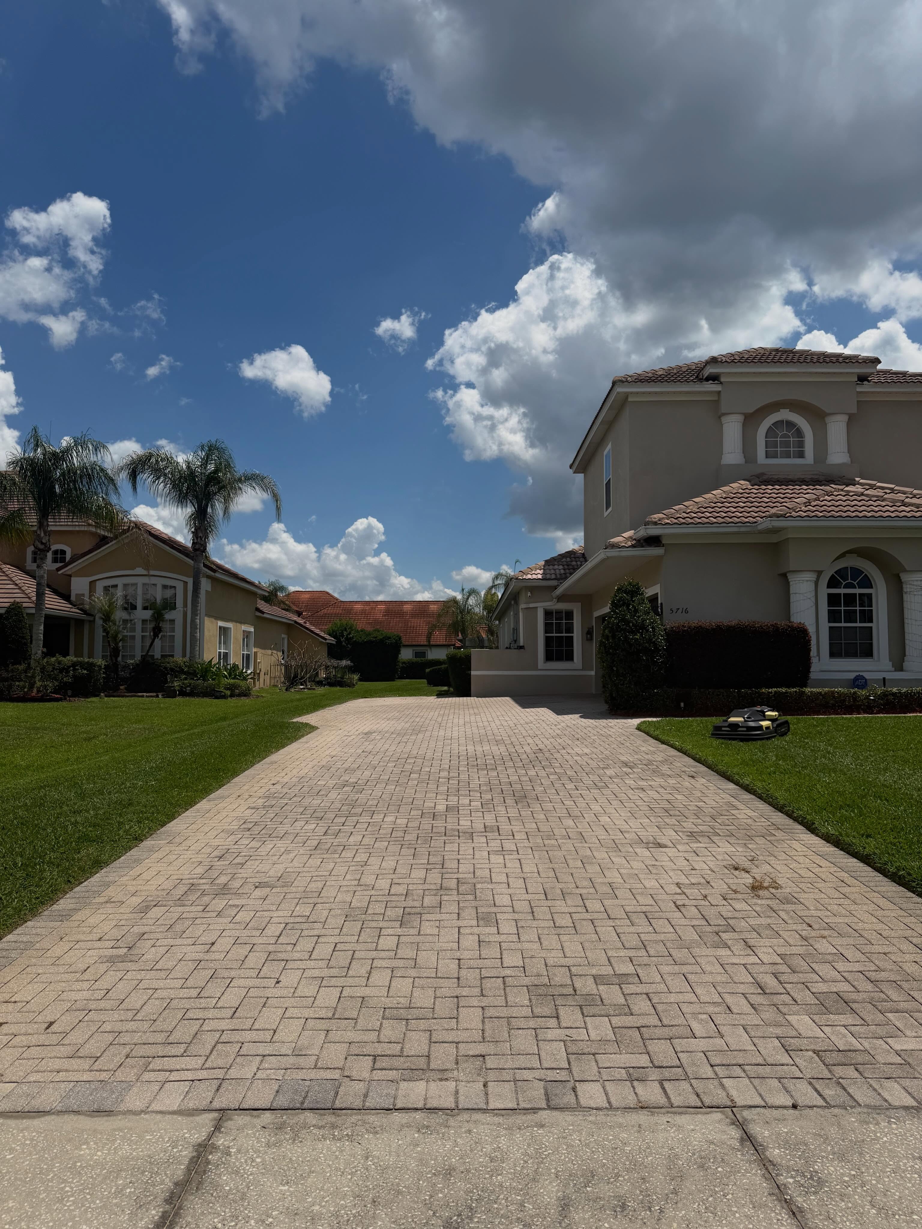 Freshly pressure washed paver driveway